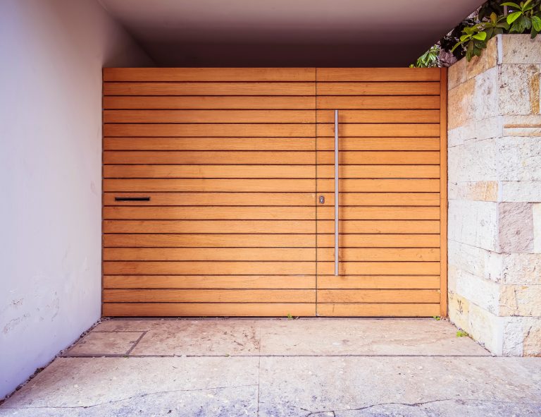 simple modern house front external wooden door by the sidewalk, Athens Greece